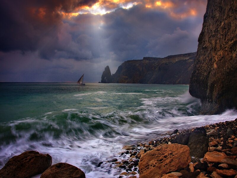 Sailboat Near Cliffs