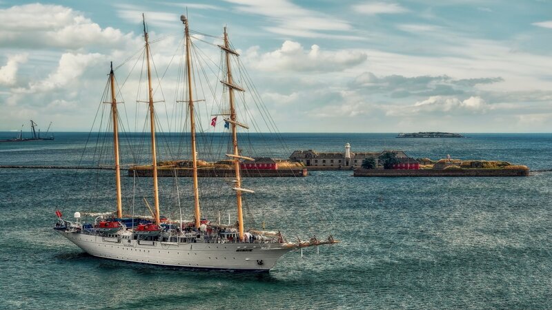 Sailboat near coastal fort