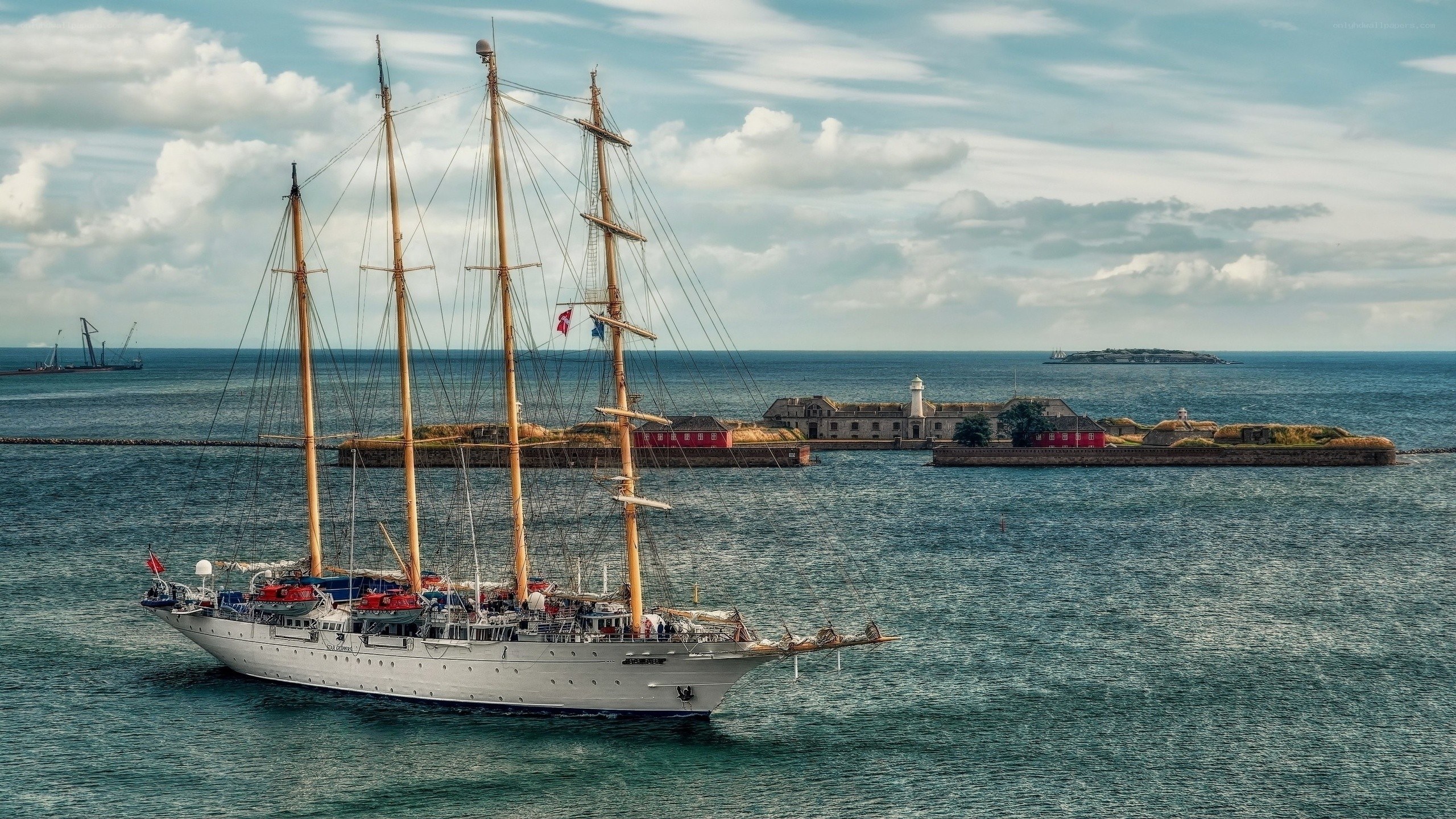 Sailboat near coastal fort