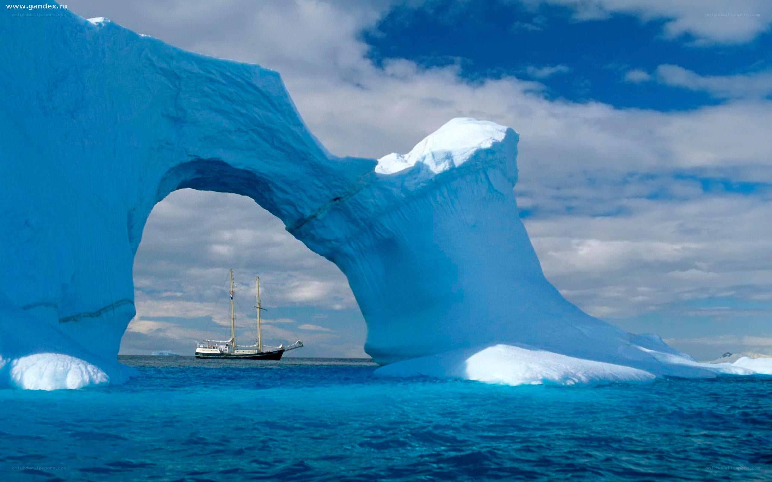 Sailboat near ice arch