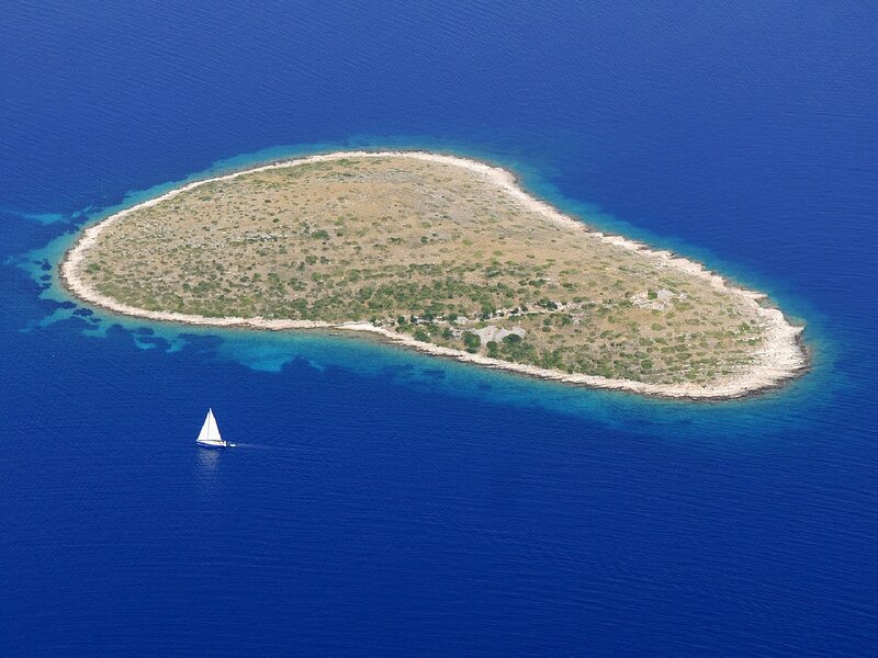 Sailboat Near Island — Blue