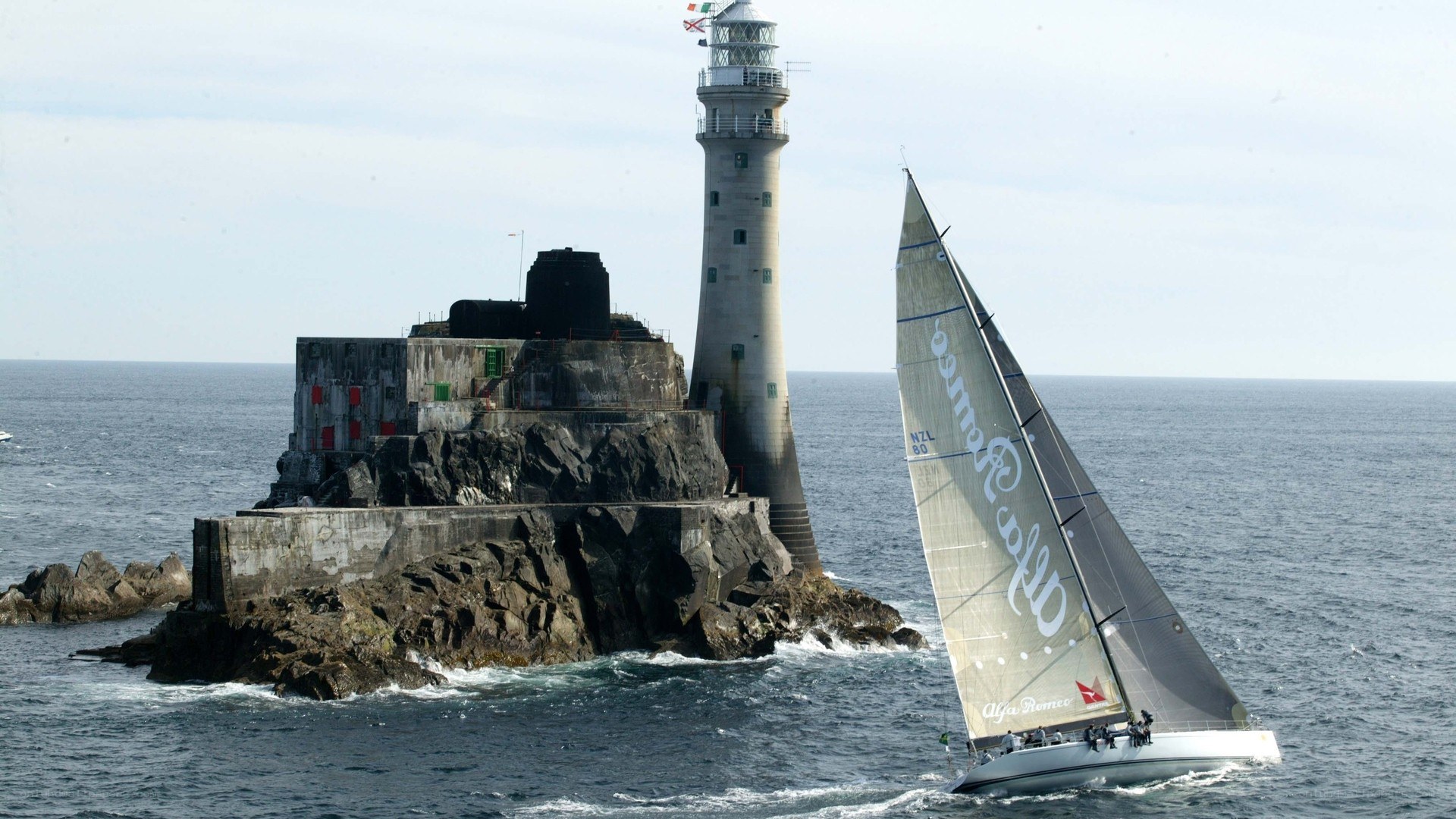 Sailboat near lighthouse