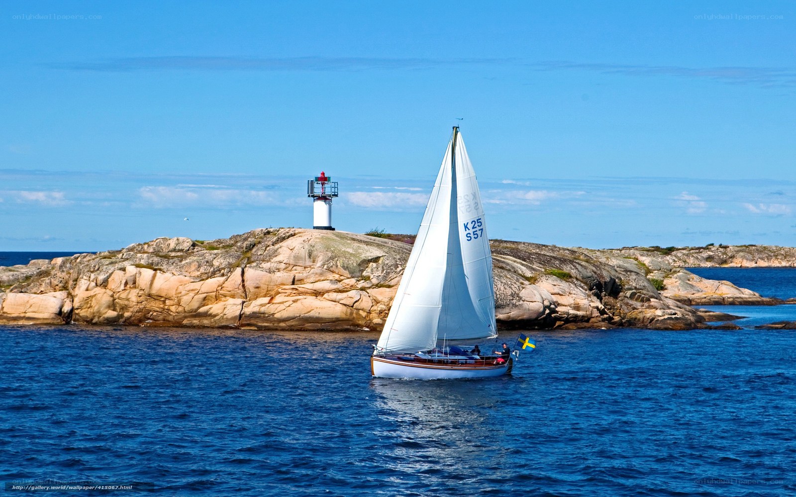 Sailboat near lighthouse