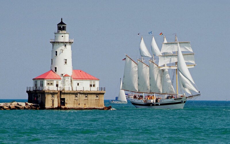 Sailboat near lighthouse