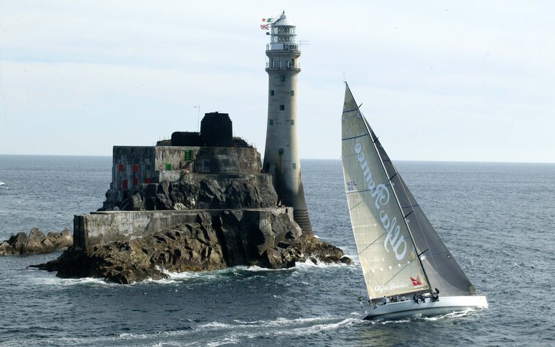sailboat near lighthouse