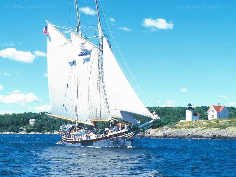 Sailboat near lighthouse