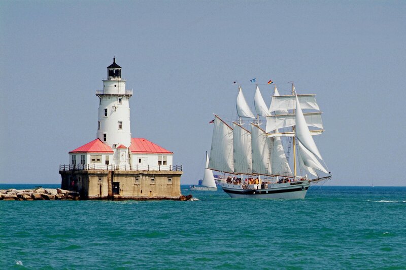 Sailboat near lighthouse