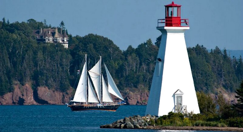 Sailboat Near Lighthouse — White