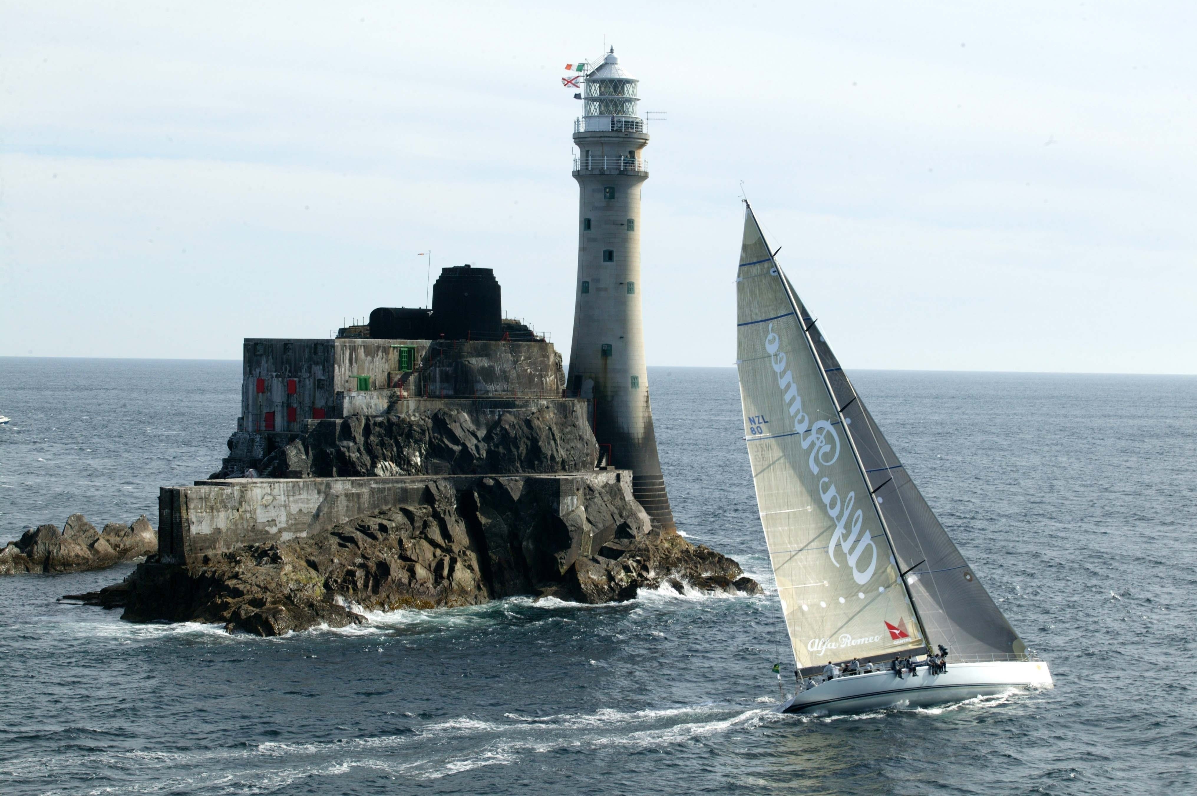 Sailboat near lighthouse