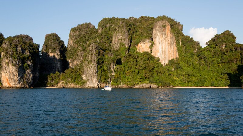 Sailboat Near Limestone Cliffs