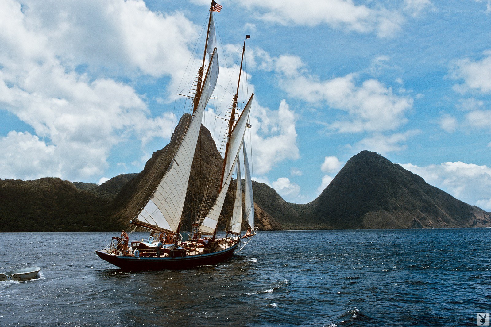 Sailboat near mountainous islands