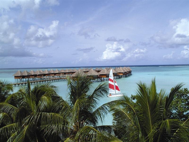 Sailboat Near Overwater Bungalows — Blue