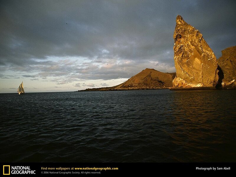Sailboat near rocky island