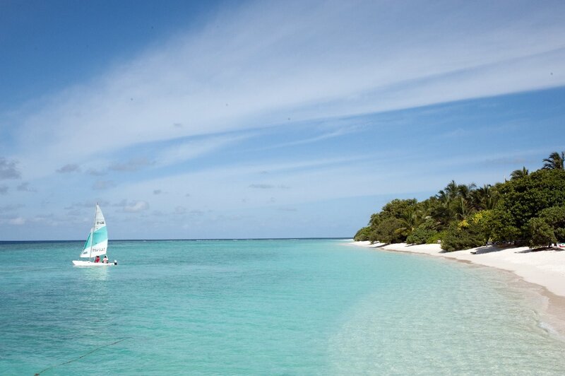 Sailboat near tropical beach