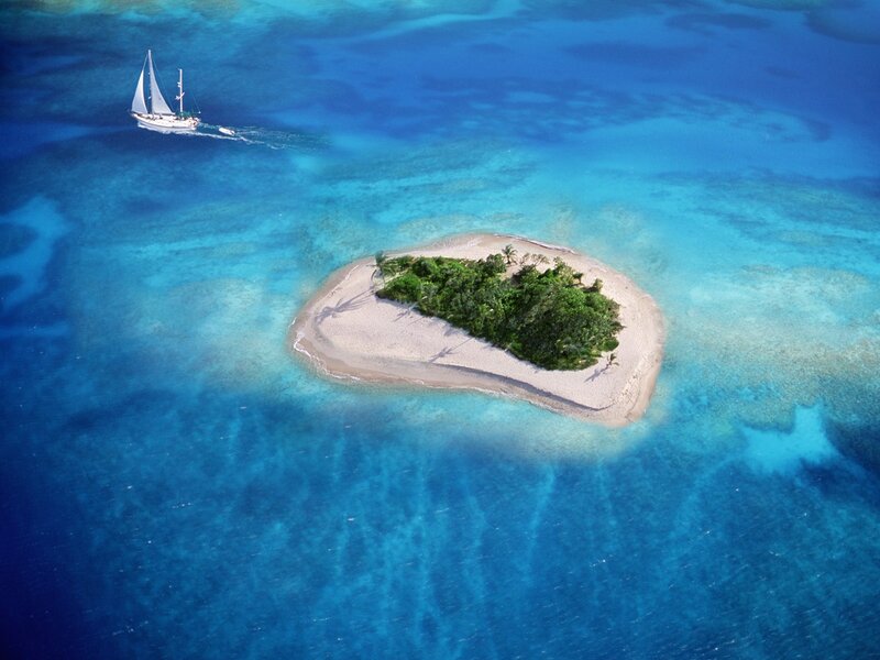 Sailboat near tropical island