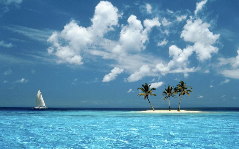 Sailboat near tropical island