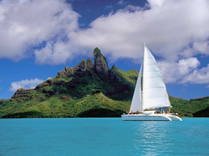 Sailboat near tropical island