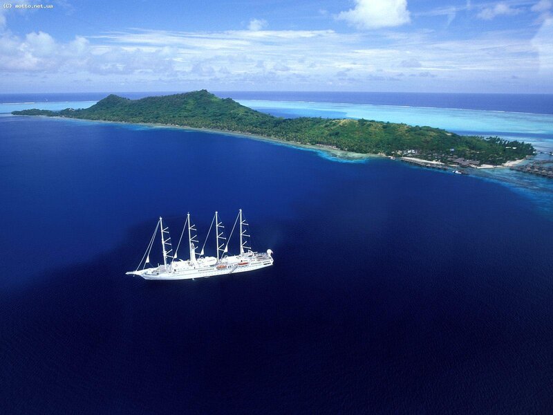 Sailboat near tropical island
