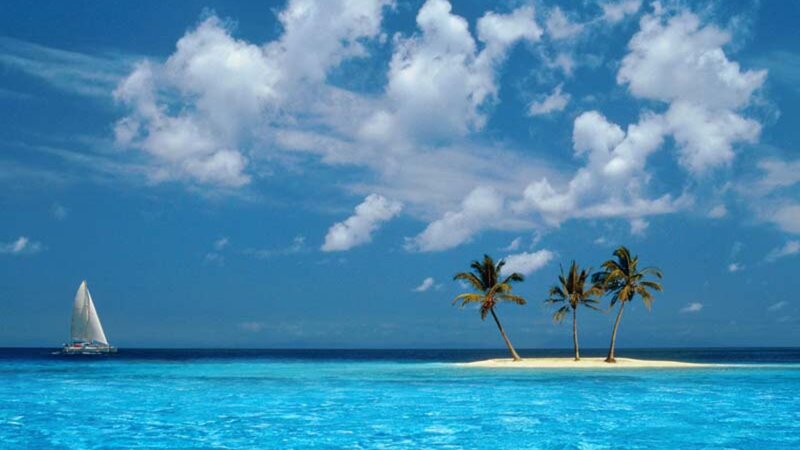 Sailboat near tropical island