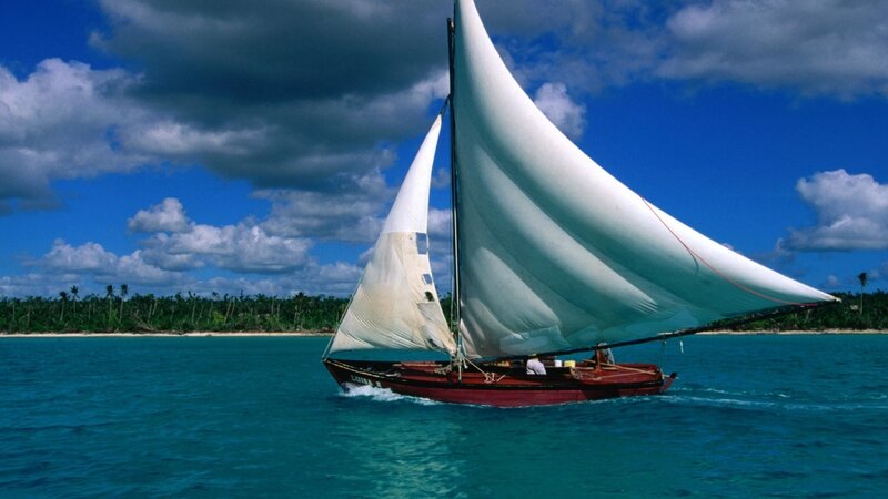 Sailboat near tropical island