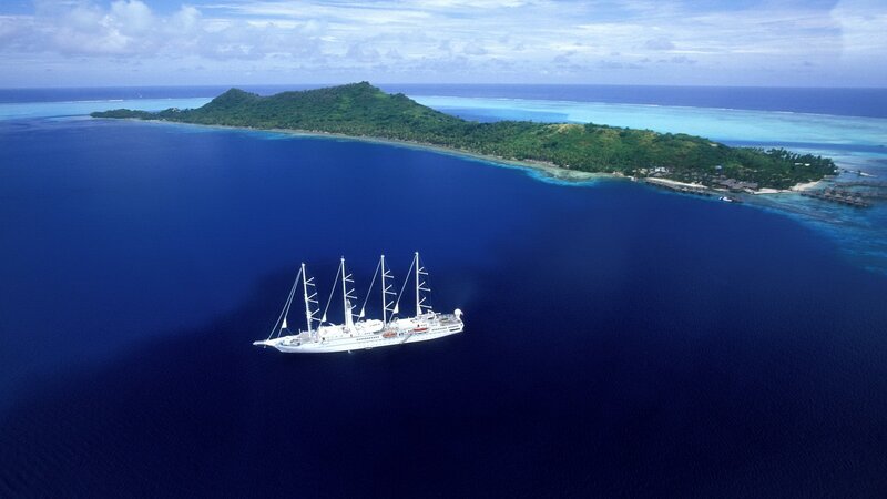 Sailboat near tropical island
