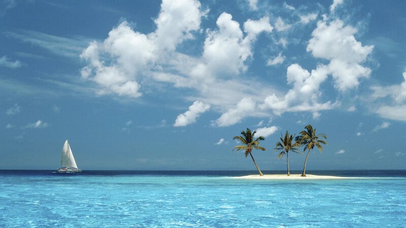 Sailboat near tropical island