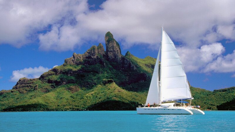Sailboat near tropical island