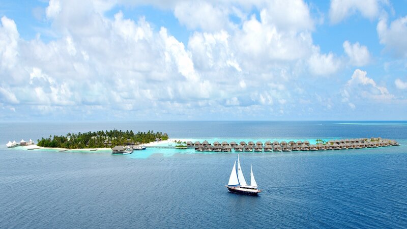 Sailboat near tropical island resort