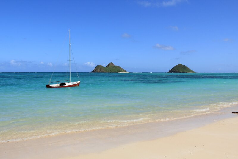 Sailboat near tropical islands