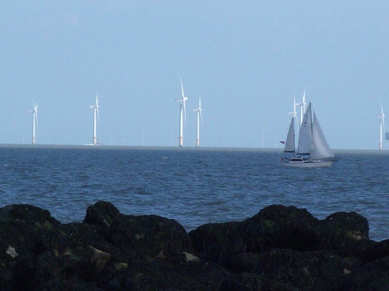 Sailboat Near Wind Turbines