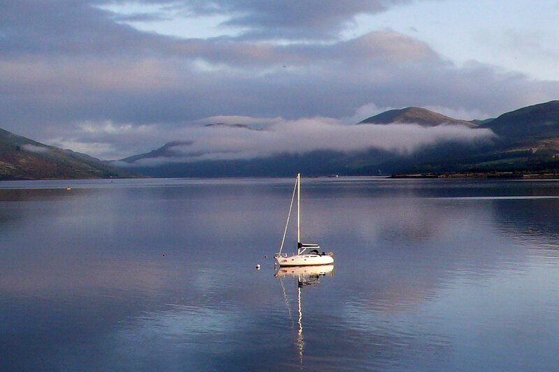 Sailboat on a misty lake