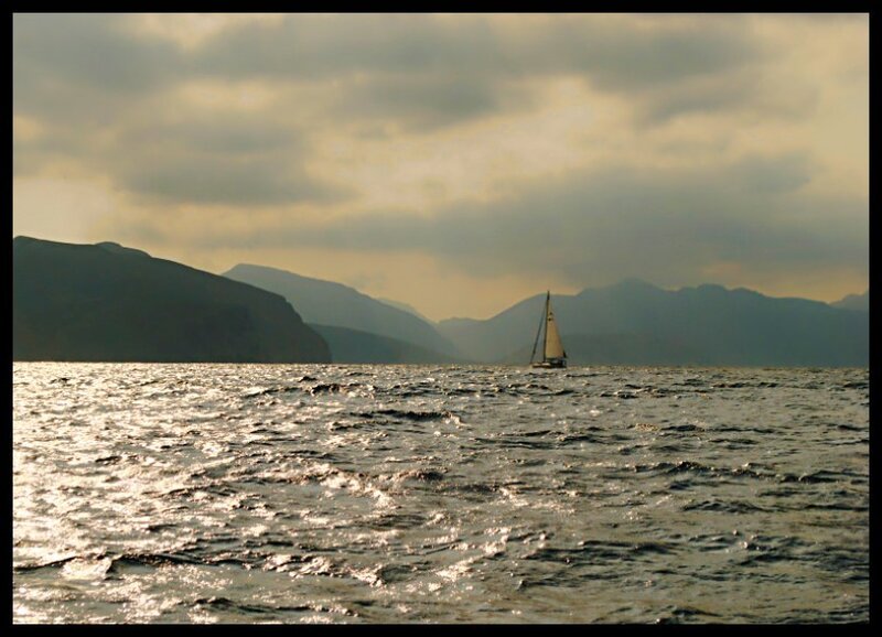 sailboat on a mountain lake