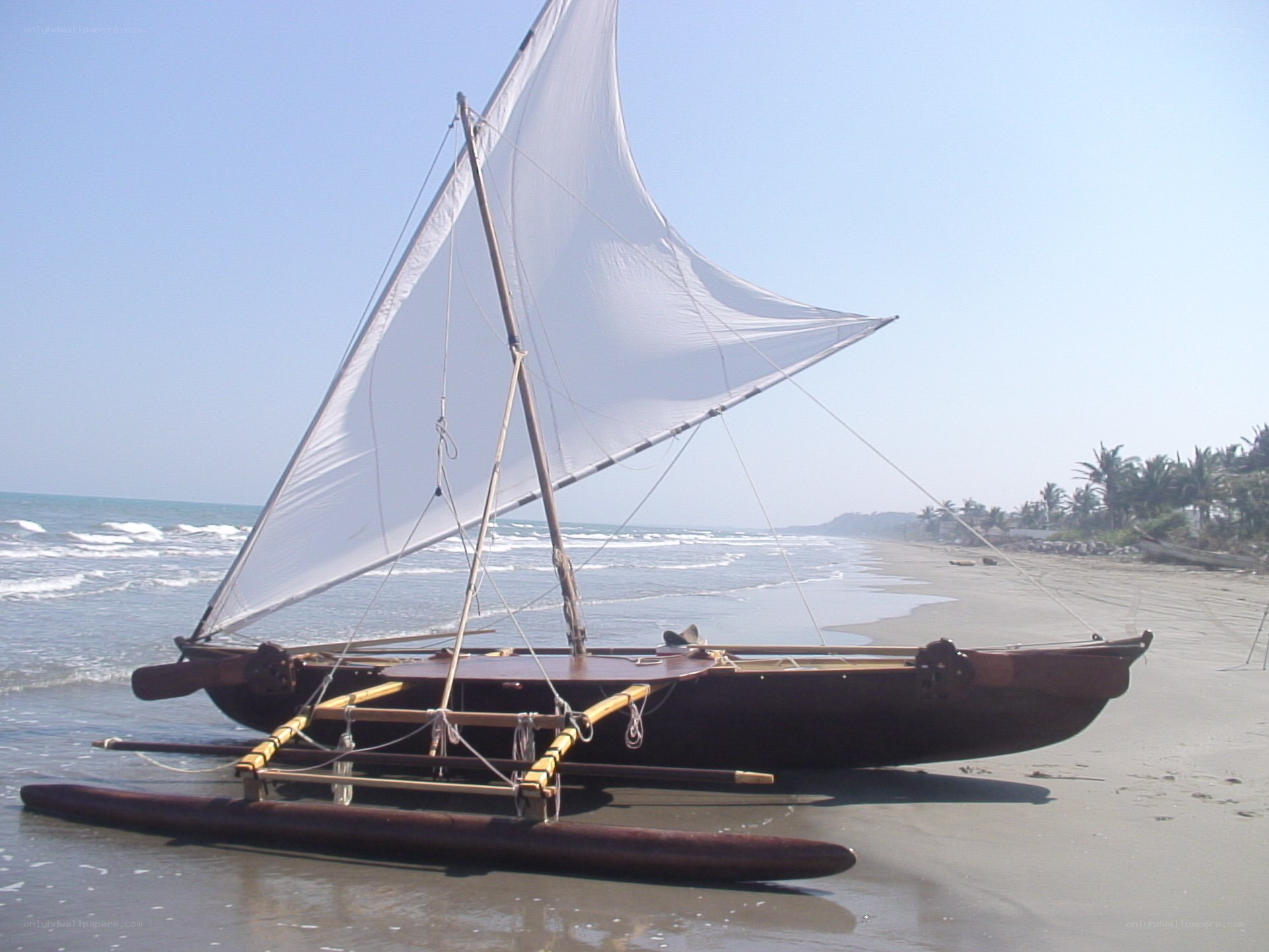 sailboat on a sandy beach