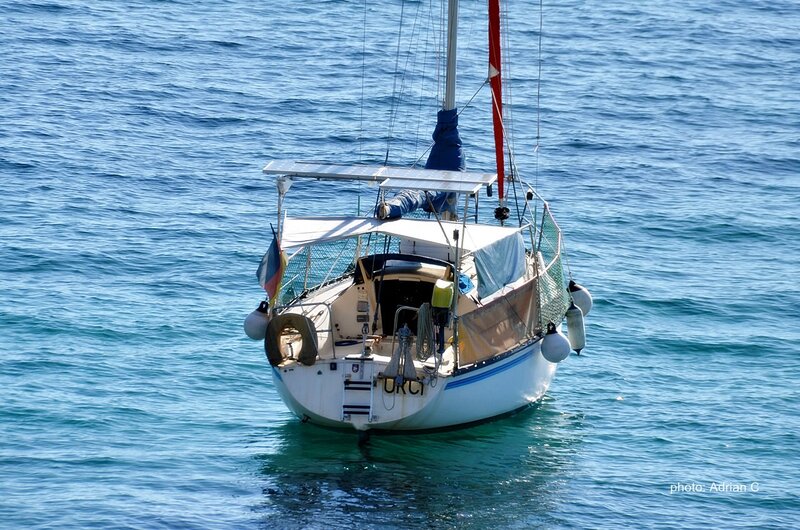 Sailboat on Blue Water — Serene, Afternoon, Photograph, Flag