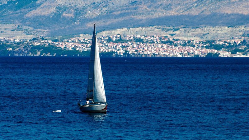 Sailboat on Blue Water — Serene, Afternoon, Photograph, Mountain