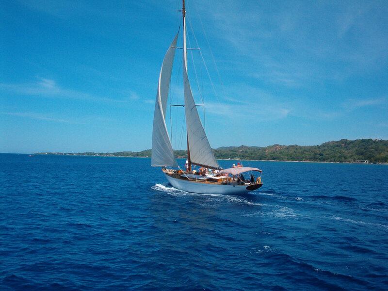 Sailboat on Blue Water — Serene, Afternoon, Photograph, People