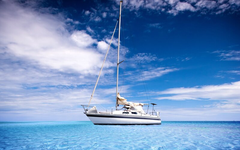 Sailboat on calm blue sea
