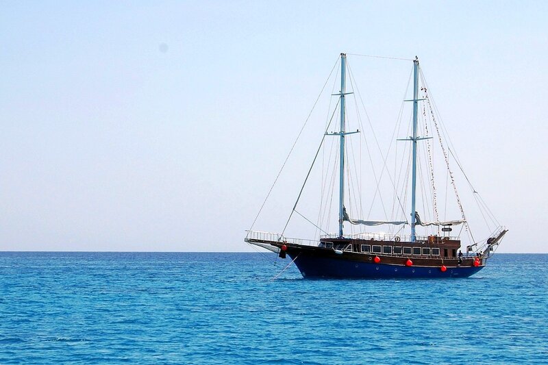 Sailboat on calm blue sea