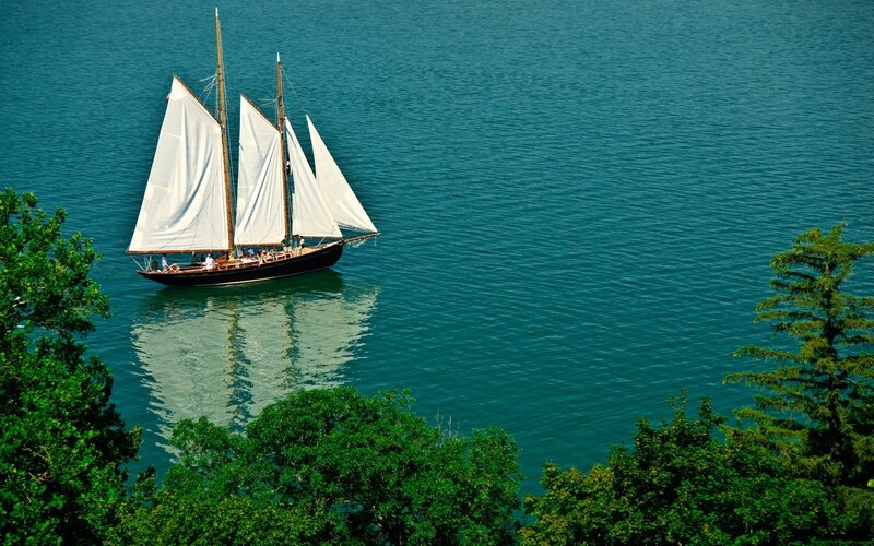 Sailboat on calm blue water