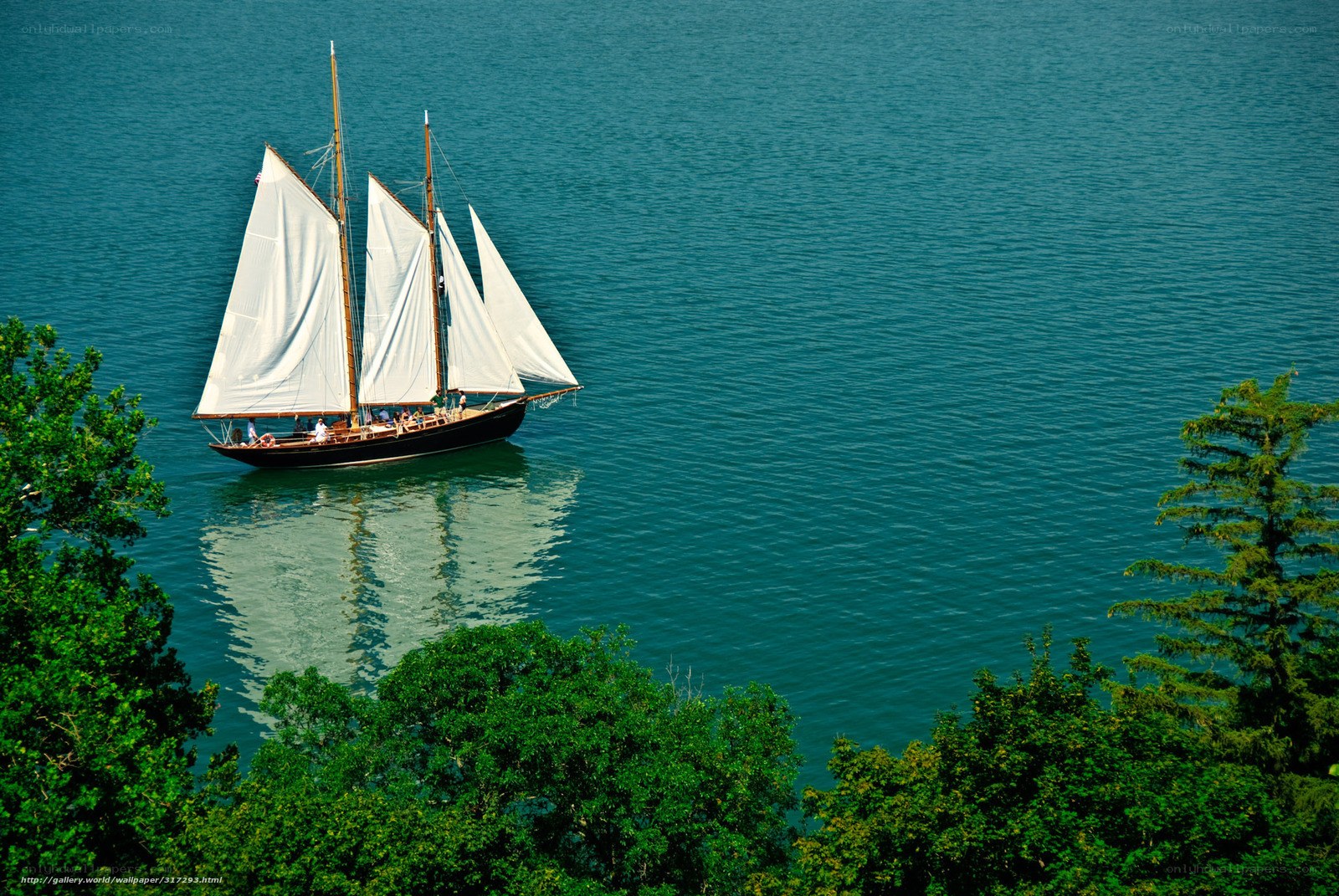 Sailboat on calm blue water