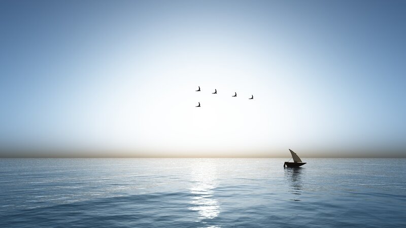 Sailboat on calm sea at sunset