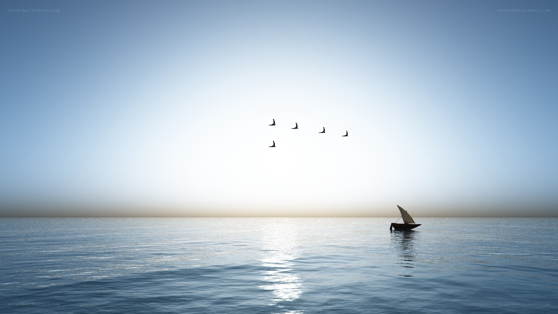 Sailboat on calm sea at sunset