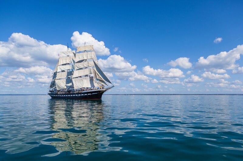 Sailboat on Calm Water — Blue, Serene, Afternoon, Photograph, Sky