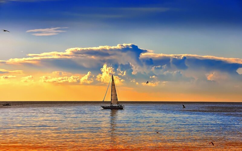 Sailboat on Calm Water — Blue, Serene, Sunset, Photograph, Clouds, Birds