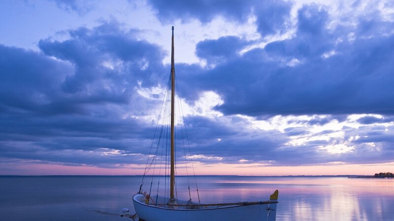 Sailboat on Calm Water — Blue, Serene, Sunset, Photograph, Sky, Clouds