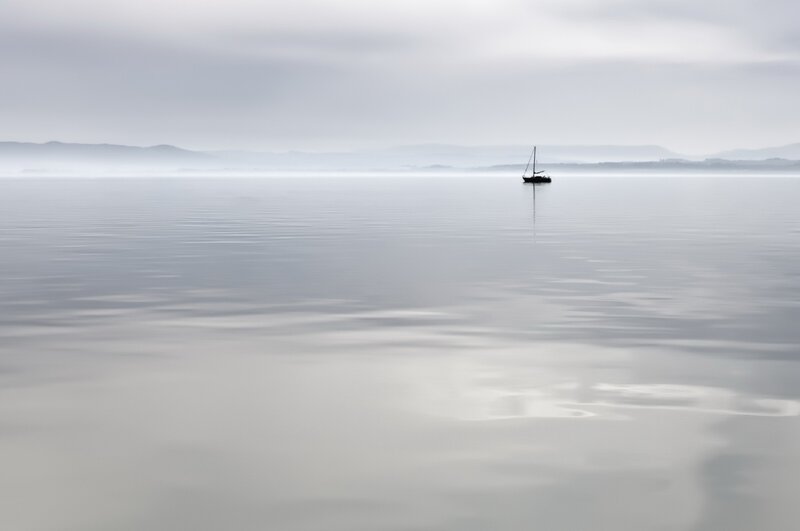 Sailboat on Calm Water — Gray, Serene