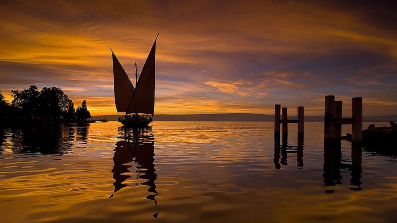 Sailboat on Calm Water — Orange, Serene, Sunset, Photograph, Pier