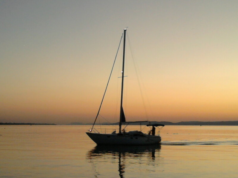 Sailboat on Calm Water — Orange, Serene