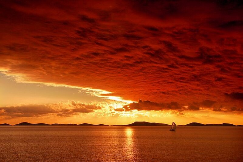 Sailboat on Calm Water — Red, Dramatic