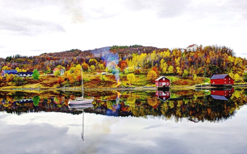 Sailboat on Calm Water — Red, Serene, Autumn